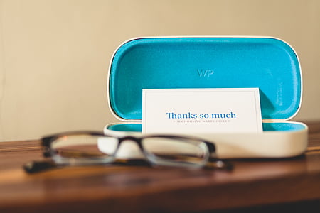 selective focus photo of blue and white eyewear case with thanks so much card thumbnail