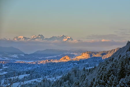 top view of snowy mountain during daytime thumbnail
