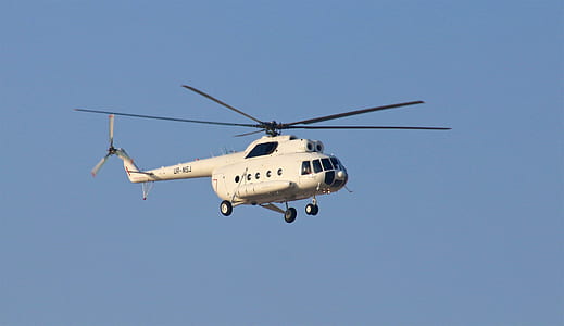 white helicopter flying on air thumbnail