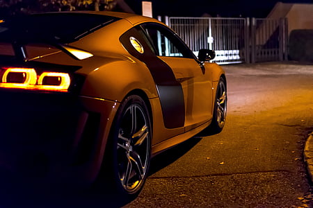brown Audi R8 parked near gate thumbnail
