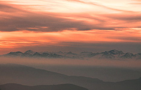 mountain covered by fogs during golden hour thumbnail