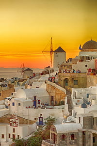 white houses near beach under orange sky thumbnail