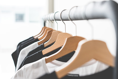 Wooden T-Shirt Hangers in Fashion Apparel Store thumbnail