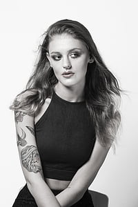 woman wearing black halter-neck top thumbnail