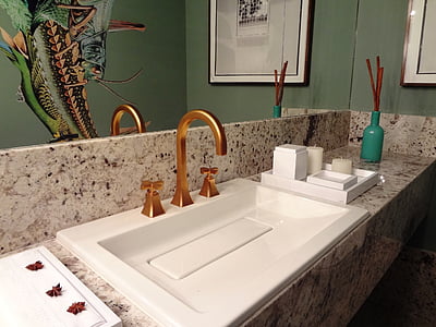 bathroom with gold white sink and gold faucet thumbnail
