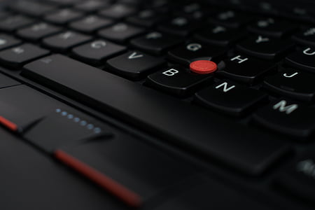 round plastic ornament on black keyboard thumbnail
