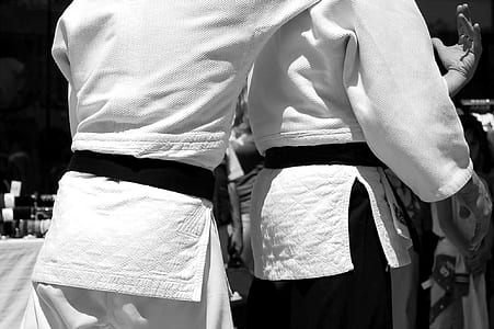 grayscale photography of two person wearing taekwondo gi uniform thumbnail