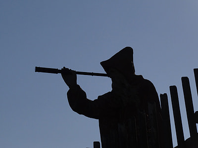 silhouette of man wearing cloak and classic monocular thumbnail