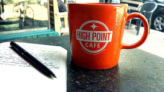 blue pen beside mug thumbnail