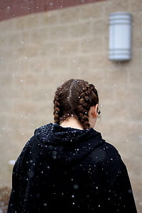 woman standing in front of wall thumbnail