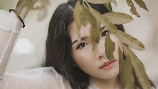 Woman Wearing Illusion Long-sleeved Shirt Under Green Leaf thumbnail