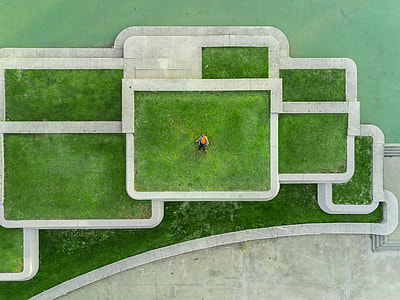 aerial photography of man lying on lawn thumbnail