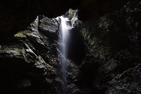 waterfalls in between brown rock thumbnail
