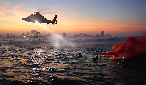 people on ocean with helicopter above them thumbnail