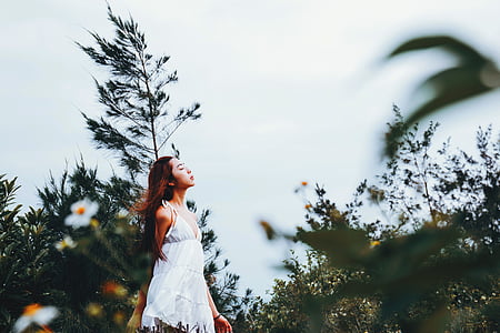 woman standing near the plants thumbnail