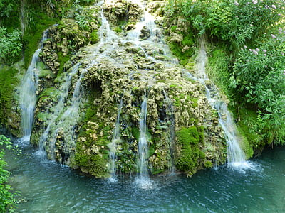 curtain waterfalls surrounded with grass thumbnail