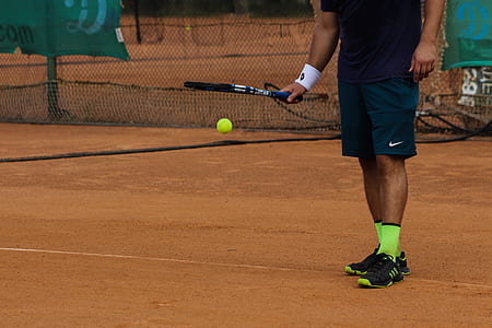 man holding tennis racket and tennis ball thumbnail
