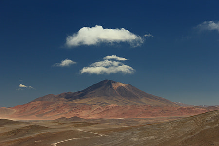 volcano under white clouds during daytime thumbnail