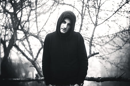 grayscale photo of man wearing hoodie thumbnail