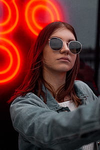 woman wearing silver-framed sunglasses thumbnail