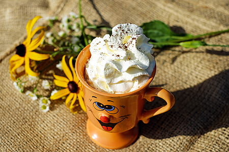 brown ceramic mug on top of brown surface thumbnail