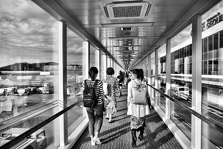 Grayscale Photo of Woman Walking on Pathway thumbnail