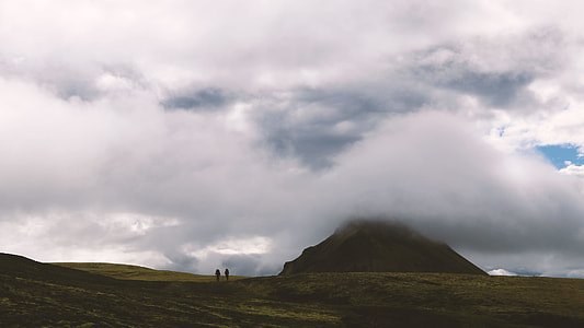two persons on green grass under white clouyds thumbnail