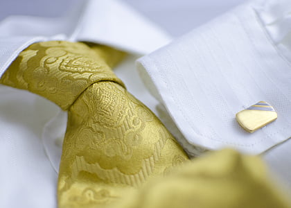 macro photography of yellow floral necktie thumbnail