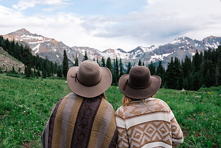 two person looking on mountains during daytime thumbnail