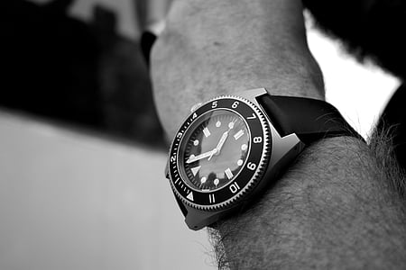 person wearing analog watch with strap thumbnail