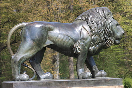 grey concrete lion statue thumbnail