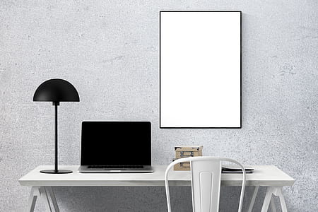 MacBook Pro on white wooden table thumbnail