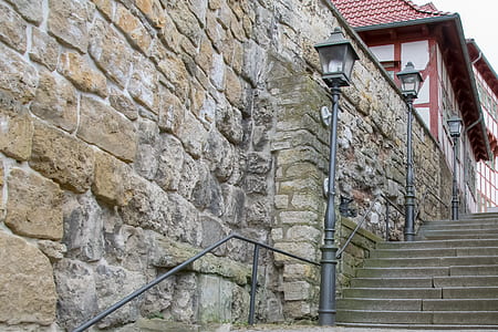 black lamp post on concrete stairsa thumbnail
