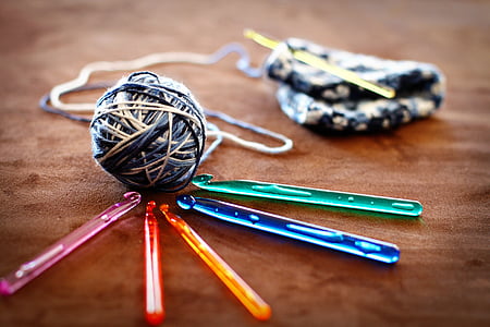 crochet ball and five assorted-color crochet sticks thumbnail
