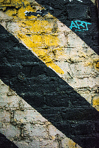 gray concrete wall with art thumbnail
