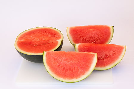 sliced watermelon on white surface thumbnail