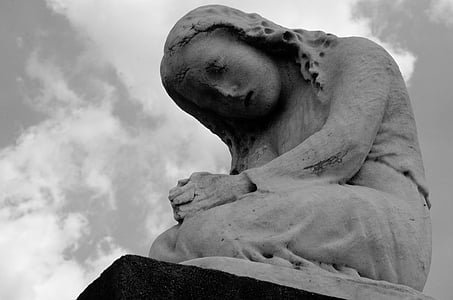 low angle photography of gray woman statue thumbnail