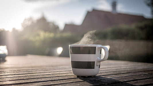 selective focus photo of ceramic mug with hot liquid thumbnail