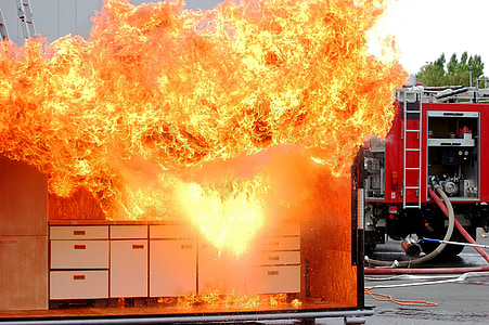white wooden sideboard on fire at daytime thumbnail