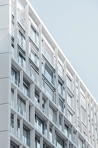 low-angle photography of white high-rise building thumbnail