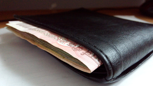black leather wallet with money thumbnail