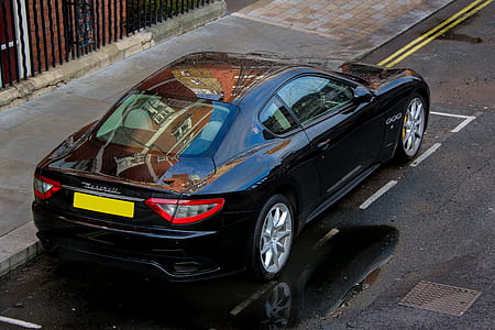 black coupe on road thumbnail