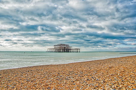seashore under cloudy sky thumbnail