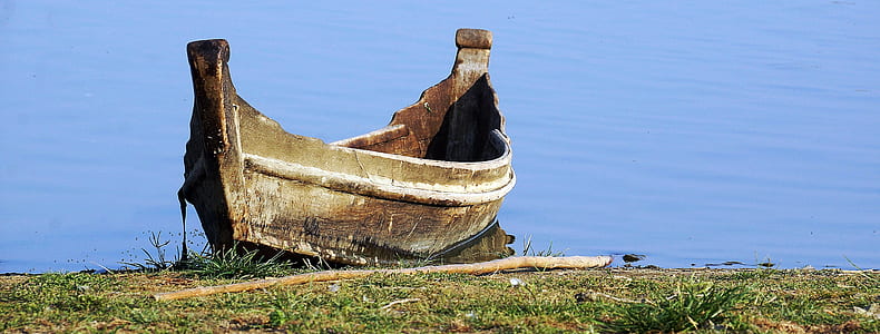 brown boat on water thumbnail