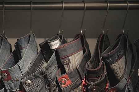 selective focus photography of blue denim bottoms thumbnail