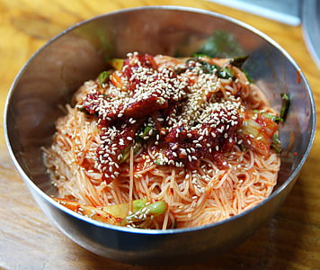pasta with tomato sauce and kimchi in bowl thumbnail
