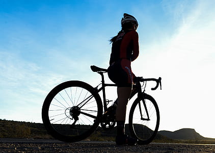 woman on road bike during daytime thumbnail