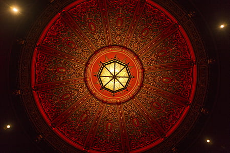 low angle photo of red and yellow dome ceiling thumbnail