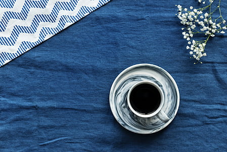 white and blue ceramic mug thumbnail