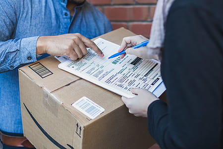Signing Shipping Forms For Large Box Photo thumbnail